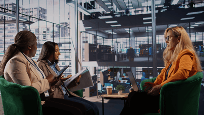 Professionals discussing continuous Oracle Cloud user adoption and enablement in a modern workplace